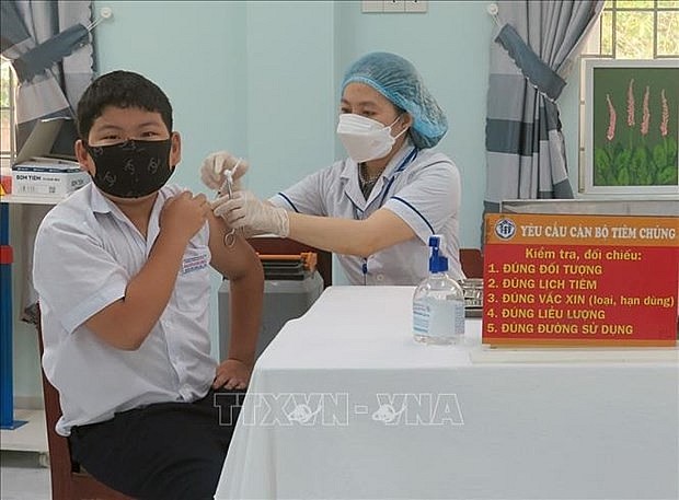 A student gets vaccinated against COVID-19 in Phu Yen province. Photo: VNA