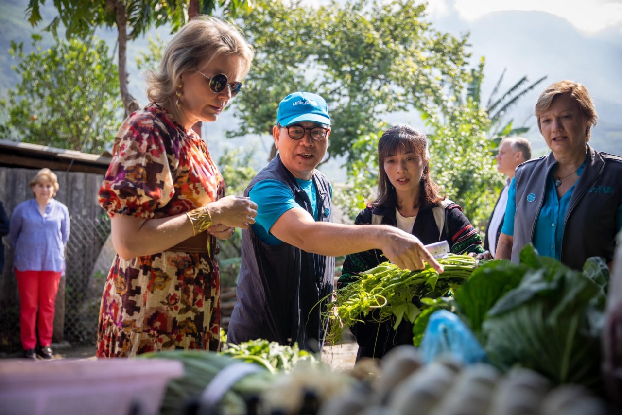 Queen Mathilde of Belgium meet with children and mothers in Hang Lao Chai village in Lao Cai, who are learning about nutritious meals through the UNICEF-supported Nutrition club.