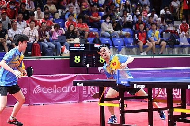 Table tennist players Dinh Anh Hoang (right) and Tran Mai Ngoc at the SEA Games 32. (Photo: VNA)