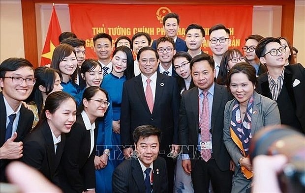Prime Minister Pham Minh Chinh meets with Vietnamese community in Japan on May 19 (Photo: VNA)
