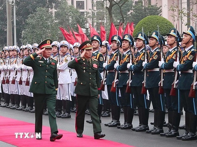 General Nguyen Tan Cuong (left), Chief of the General Staff of the Vietnam People’s Army, and Lieutenant General Saichay Kommasith, Deputy Minister of National Defence and Chief of General Staff of the Lao People's Army, review the Guard of Honor of the Vietnam People's Army at the welcome ceremony for the Lao official in Hanoi on March 5. (Photo: VNA)