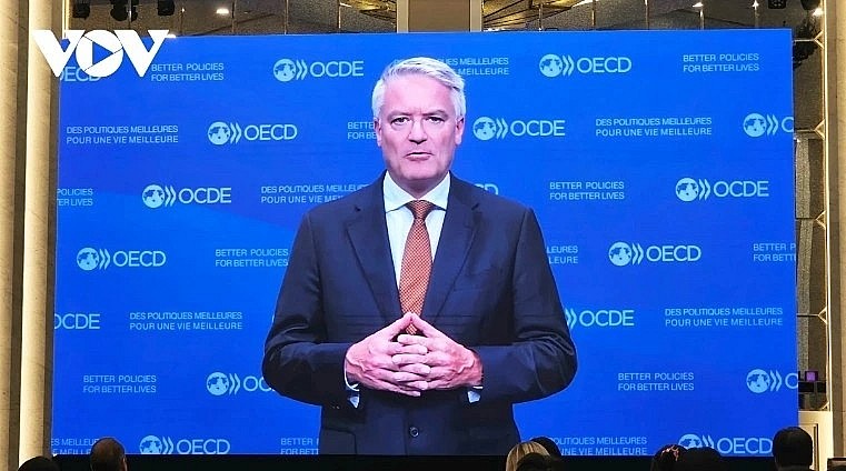OECD Secretary-General Mathias Cormann delivers a video message to the event.