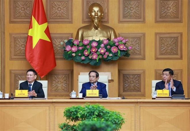 Prime Minister Pham Minh Chinh (centre) at the meeting (Photo: VNA)