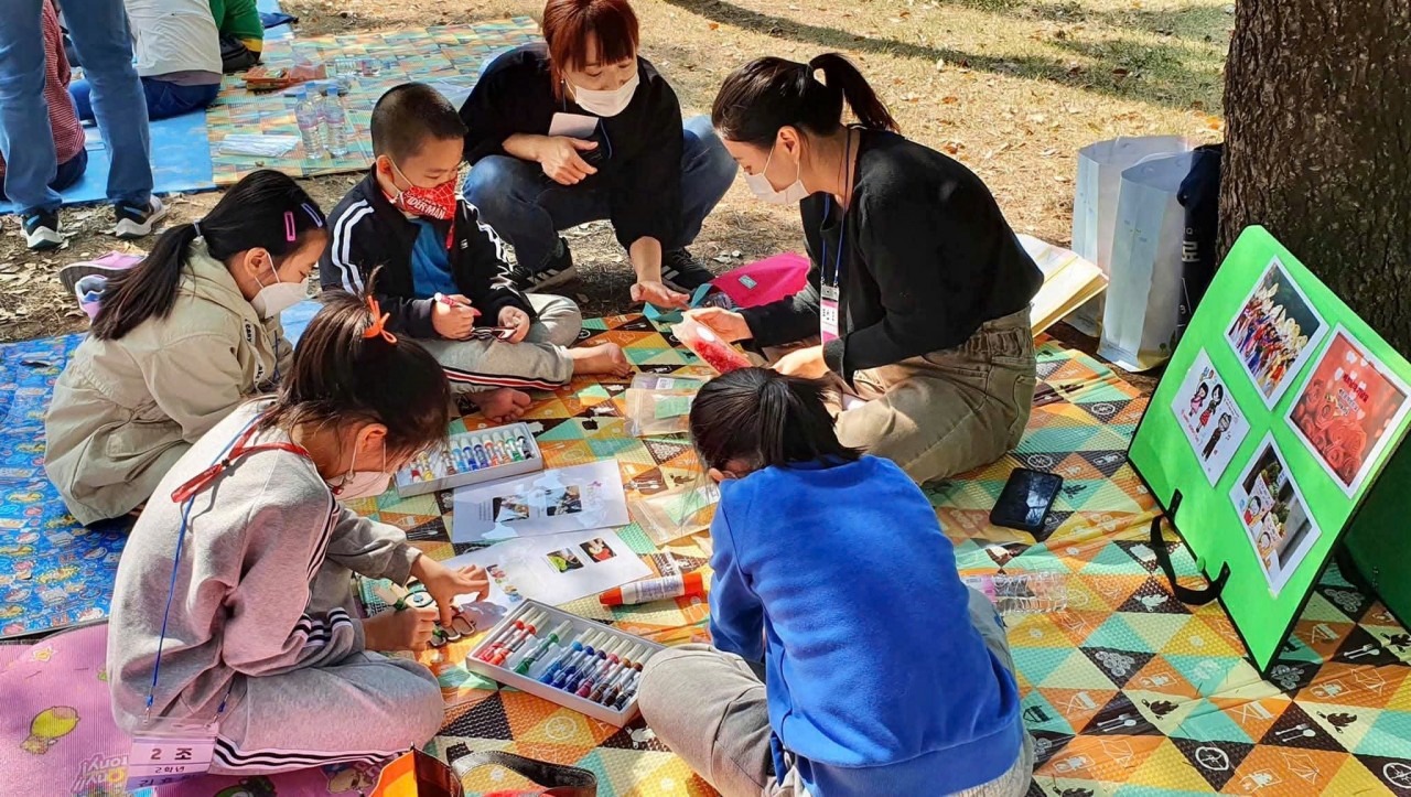 She helps her students learn about traditional Vietnamese holidays. She helps her students learn about traditional Vietnamese holidays.