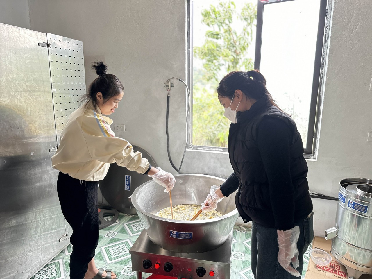 A group of young women in Phong Tho district (former Lai Chau province) produces dried bananas — a livelihood model supported by Plan International that creates stable jobs and income. (Photo: Plan International)