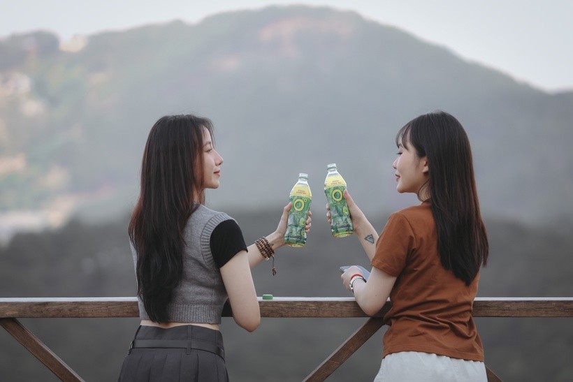 In the midst of the windy sky, young people enjoy a sip of cool Zero Degree Green Tea to Gen Z Finds Their Chill with Zero Degree Green Tea During Stress Season
