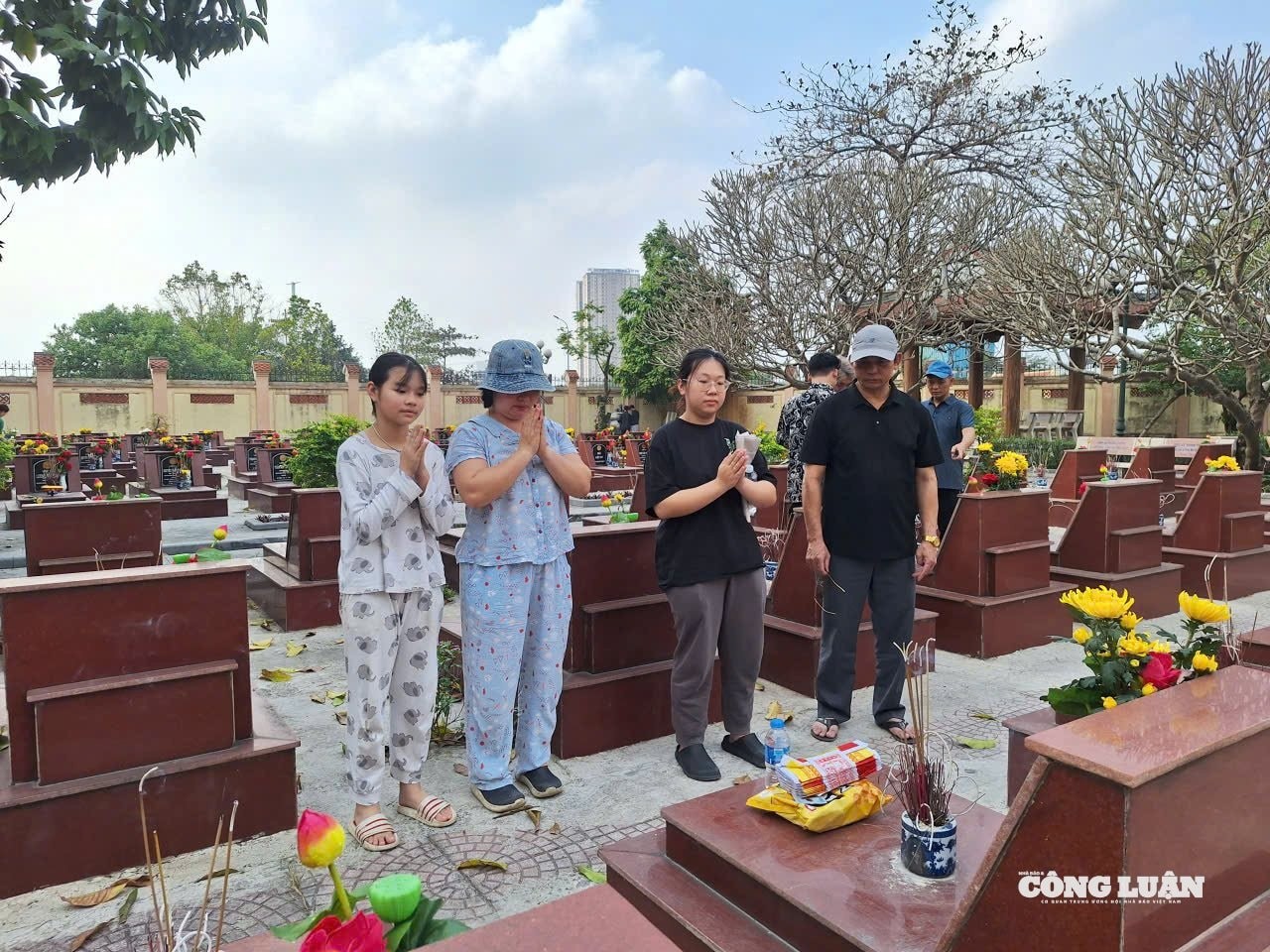 There are families of multiple generations who uphold the habit of visiting cemeteries and tending to family graves to invite their loved ones home for Tet, as a way to begin the new year.