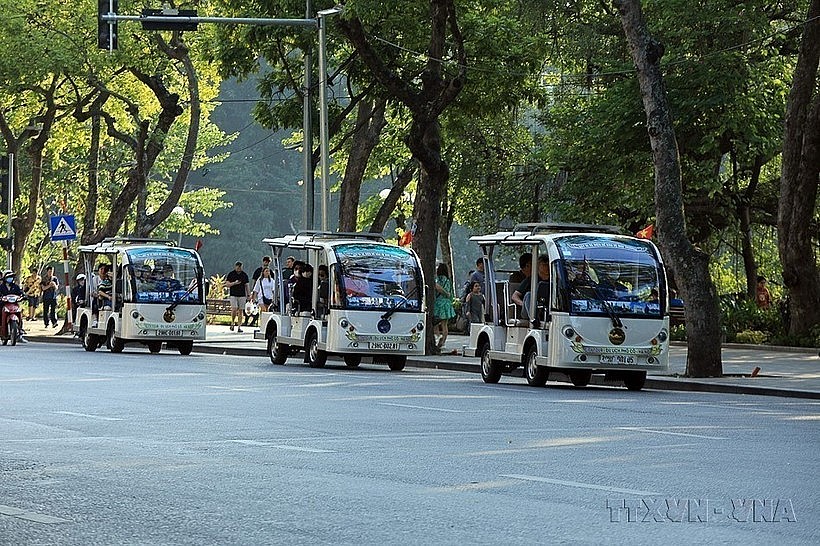 Electric vehicles are used to serve tourists in Hanoi. (Photo: VNA)