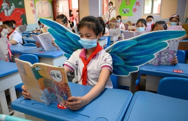 chinese students wear adorable social distancing wings at school