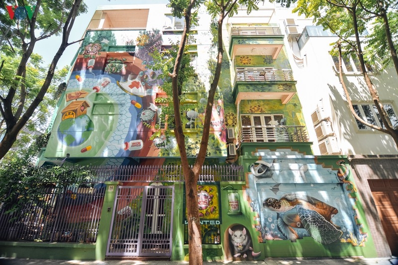 Artful masion in Hanoi with COVID-19-themed communication graffiti catches attention artful masion in hanoi with covid 19 themed propoganda graffiti catches attention