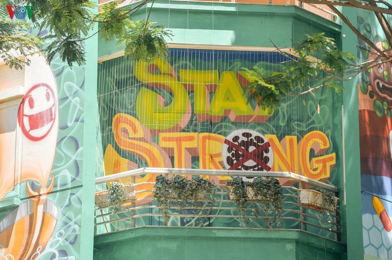 Artful masion in Hanoi with COVID-19-themed communication graffiti catches attention artful masion in hanoi with covid 19 themed propoganda graffiti catches attention