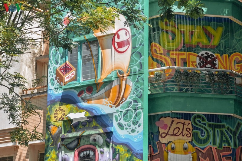 Artful masion in Hanoi with COVID-19-themed communication graffiti catches attention artful masion in hanoi with covid 19 themed propoganda graffiti catches attention