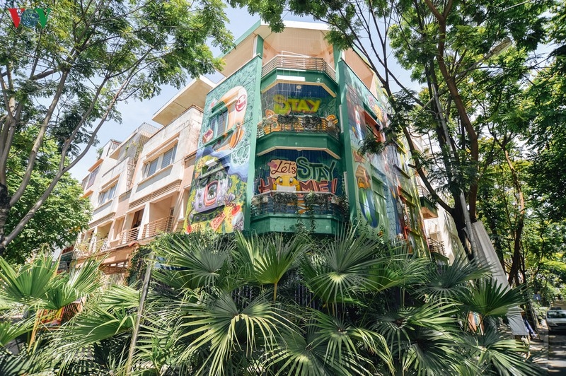 Artful masion in Hanoi with COVID-19-themed communication graffiti catches attention artful masion in hanoi with covid 19 themed propoganda graffiti catches attention