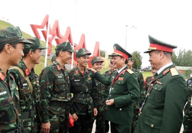 In pictures: Vietnam puts on impressive fire performance, finishes first in qualifying match The team are praised and congratulated on by Lieutenant-General Ngo Tien Minh