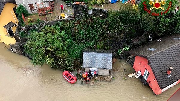At least four people have been killed in flooding in a mountainous border region of France and Italy, 