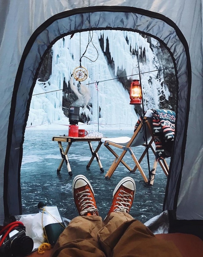 Vietnamese tourists camp on frozen river