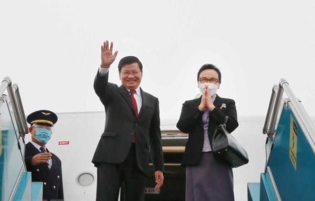 Party General Secretary and President of Laos Thongloun Sisoulith and his spouse. Photo VNA