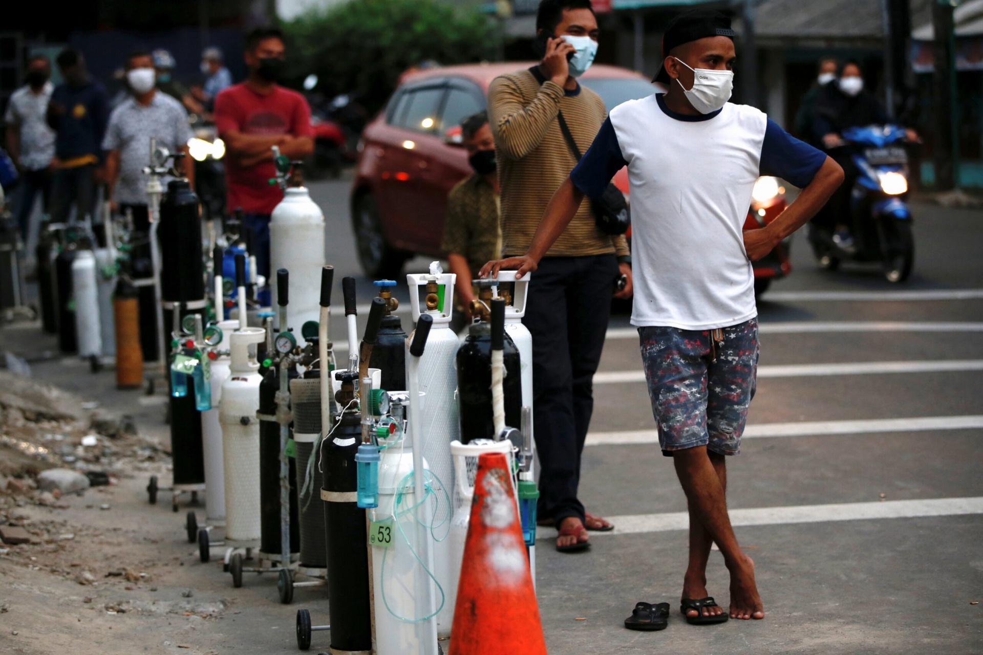 People queue to refill oxygen tanks as Indonesia experiences an oxygen supply shortage. Photo Reuters