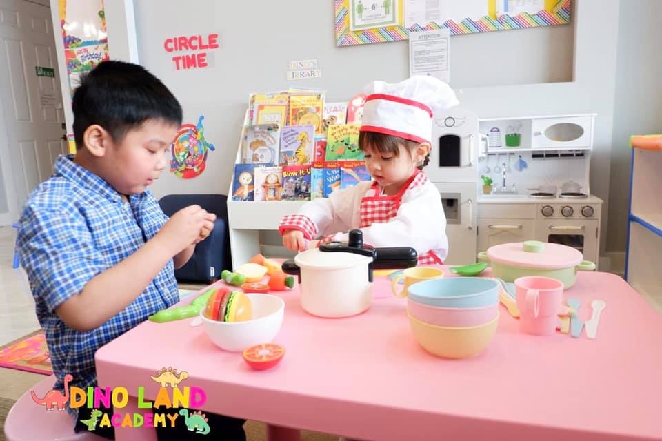 Children at Dino Land Academy role play as chefs. Photo courtesy of the academy
