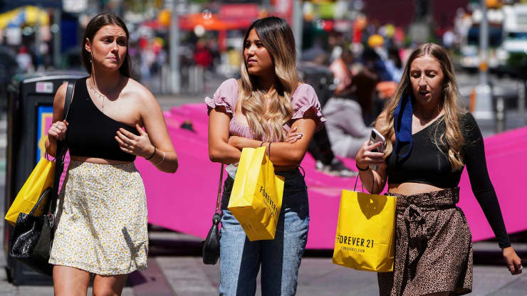 People walk without protective masks in Times Square amid the coronavirus disease (COVID-19) pandemic in the Manhattan borough of New York City, New York, U.S., May 4, 2021. Carlo Allegri | Reuters