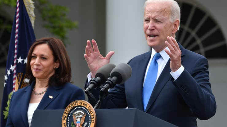 US Vice President Kamala Harris looks on as US President Joe Biden delivers remarks on Covid-19 response and the vaccination program, from the Rose Garden of the White House, Washington, DC on May 13, 2021. Nicholas Kamm | AFP | Getty Images