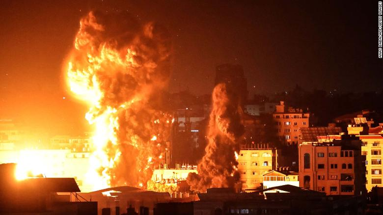 Smoke rises above buildings in Gaza City as Israeli warplanes target the Palestinian enclaves early Monday. (Photo: CNN) 