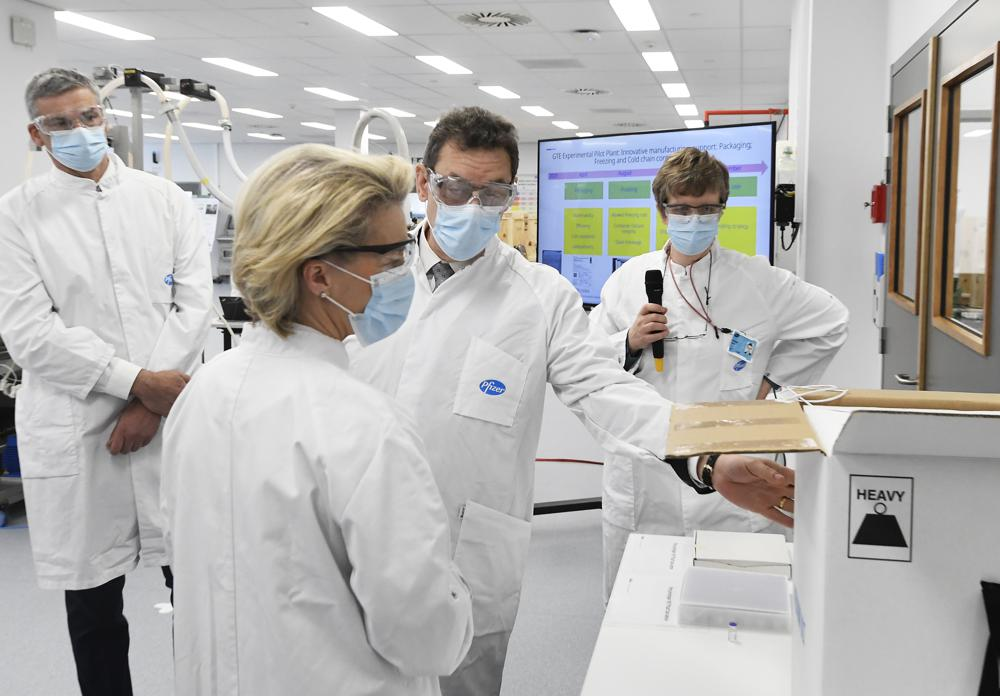  In this Friday, April 23, 2021 file photo, European Commission President Ursula von der Leyen, second left, speaks with Pfizer CEO Albert Bourla, center right, during an official visit to the Pfizer pharmaceutical company in Puurs, Belgium. The European Union cemented its support for Pfizer-BioNTech and its novel COVID-19 vaccine technology on Saturday, May 8, 2021 by agreeing to a massive contract extension for a potential 1.8 billion doses through 2023. 