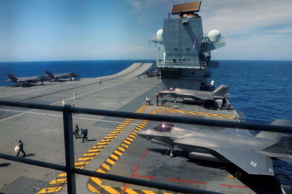 F-35B Lightning II aircrafts are seen on the deck of the HMS Queen Elizabeth aircraft carrier offshore Portugal, May 27, 2021. Picture taken through the window. REUTERS/Bart Biesemans