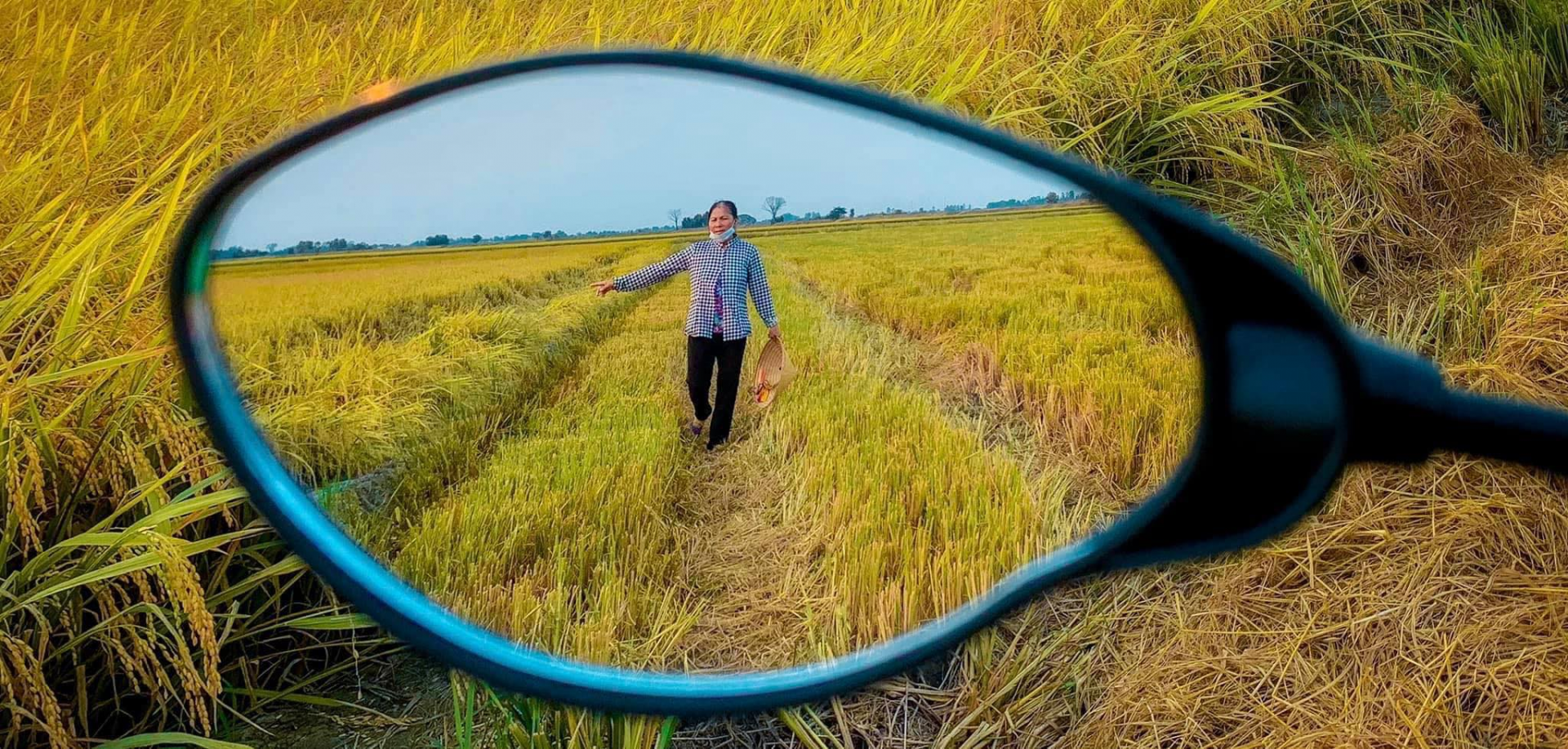 Young man captures his hometown through rear-view mirror