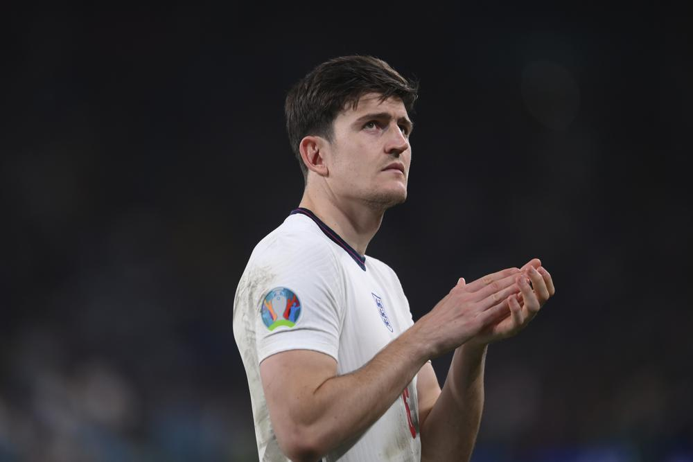 England's Harry Maguire applauds after the penalty shootout of the Euro 2020 soccer final match between England and Italy at Wembley stadium in London, Sunday, July 11, 2021. (Laurence Griffiths/Pool via AP)
