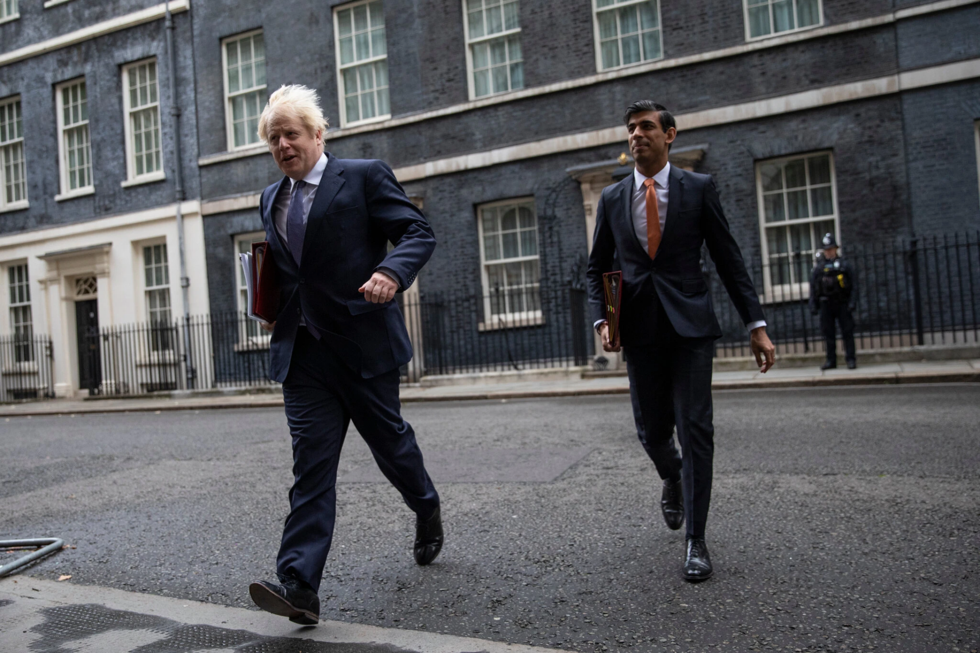 Prime Minister Boris Johnson and his finance chief, Rishi Sunak, the chancellor of the Exchequer, in London in October. They both said on Sunday that they would enter quarantine.Credit...Dan Kitwood/Getty Images