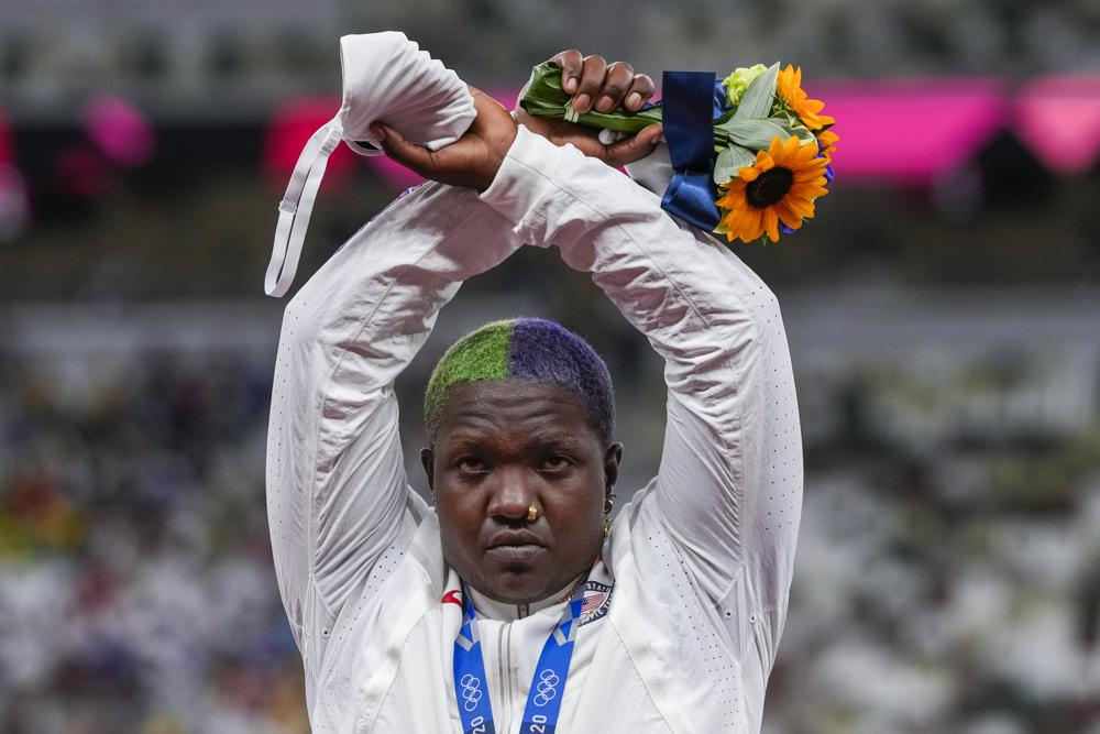Raven Saunders, of the United States, poses with her silver medal on women's shot put at the 2020 Summer Olympics, Sunday, Aug. 1, 2021, in Tokyo, Japan. (AP Photo/Francisco Seco)