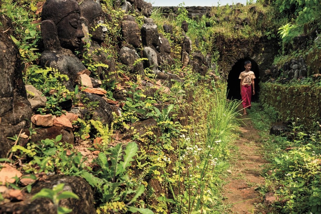 Seated Buddha sculptures flank a passageway inside the ruins of Mrauk U’s largest temple, Kothaung, which sprawls a massive 230 by 250 feet. Mario Weigt / Anzenberger / Redux