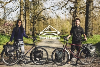 vietnamese french couple cycles from europe to asia for needy children