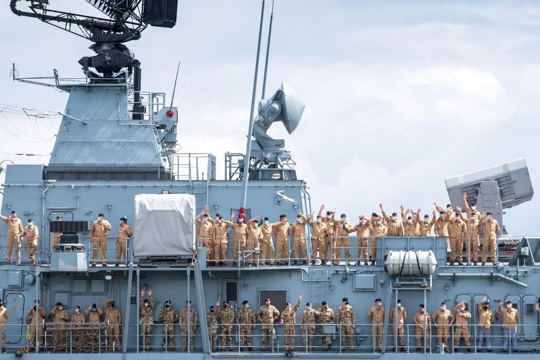 Crew members of the Bayern wave as the frigate sets sail on an exercise voyage lasting about six months in the Indian and Pacific Oceans. Photo: DPA