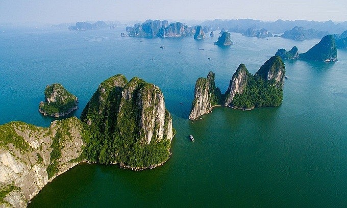 Limestone karst mountains rise out of the waters in Ha Long Bay, Quang Ninh Province. Photo by Shutterstock