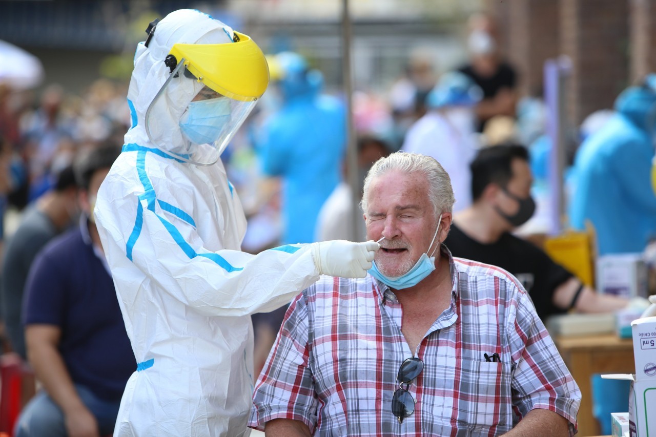 covid 19 foreigners in major cities get vaccine shots financial aid