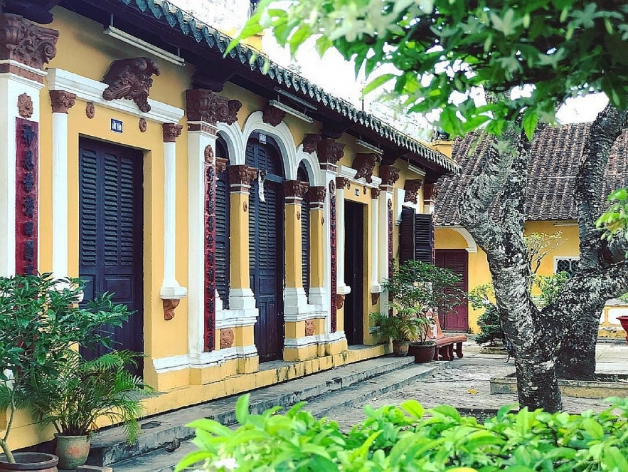 Admiring two century-old communal house in Mekong Delta