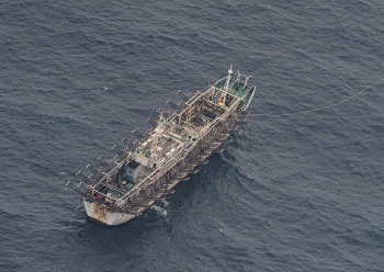 a massive chinese fishing fleet is under surveillance near galapagos over ecological concerns