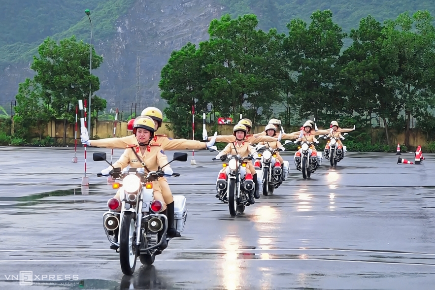 Vietnamese traffic policewomen exercise to lead groups of delegation by powerful motorcycles. Vietnamese traffic police women exercise to lead groups of delegation by powerful motorcycles.