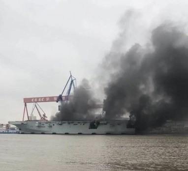 A new Chinese amphibious assault ship caught fire