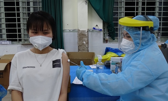 A woman gets Covid-19 vaccine in HCMC, August 5, 2021. Photo: VnExpress