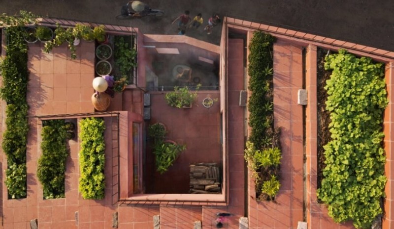 a rich vegetable garden grows atop a unique home in vietnam