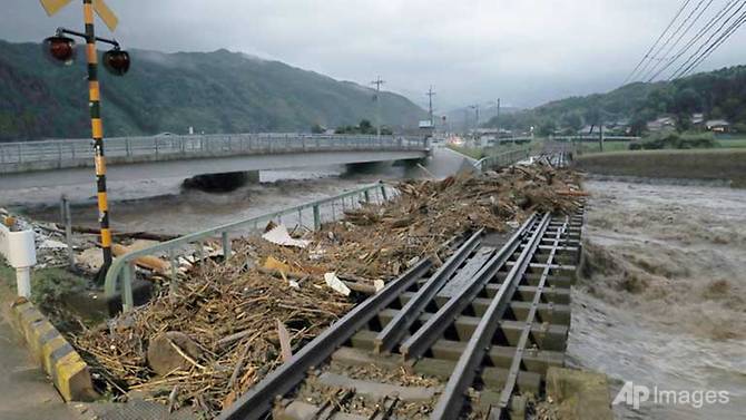 At least 10 missing and 400,000 evacuated as heavy rain pounds Japan: NHK